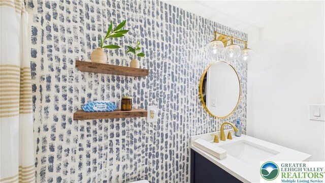 112 Moshannon Dr, Coolbaugh Twp, PA 18347 - bathroom with wallpapered walls and vanity