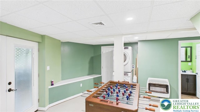 112 Moshannon Dr, Coolbaugh Twp, PA 18347 - recreation room featuring heating unit, estacked washer and dryer, a drop ceiling, and a sink