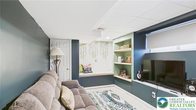 112 Moshannon Dr, Coolbaugh Twp, PA 18347 - living room featuring built in shelves and a drop ceiling