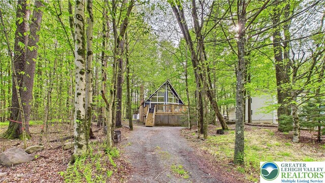 112 Moshannon Dr, Coolbaugh Twp, PA 18347 - view of dirt / gravel road featuring a wooded view and stairs