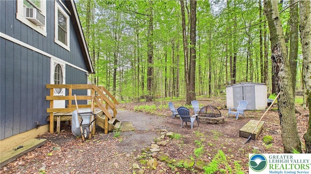 112 Moshannon Dr, Coolbaugh Twp, PA 18347 - view of yard with an outdoor fire pit and a wooden deck