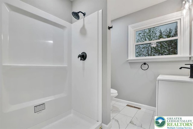 5653 Sullivan Trl, Plainfield Twp, PA 18064 - bathroom with marble finish floors, a shower stall, baseboards, toilet, and a sink