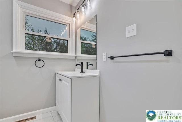 5653 Sullivan Trl, Plainfield Twp, PA 18064 - bathroom with baseboards, vanity, and marble look tile flooring