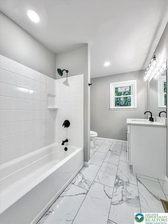 5653 Sullivan Trl, Plainfield Twp, PA 18064 - full bathroom featuring toilet, vanity, marble finish flooring, recessed lighting, and bathtub / shower combination