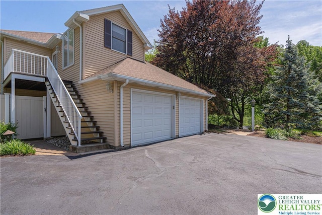 1845 Lehigh Pkwy N, Allentown City, PA 18103 - view of home's exterior featuring a garage, stairway, and a shingled roof