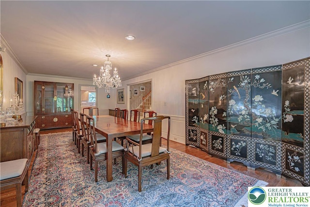 1845 Lehigh Pkwy N, Allentown City, PA 18103 - dining space featuring a chandelier, ornamental molding, stairs, wainscoting, and wood finished floors
