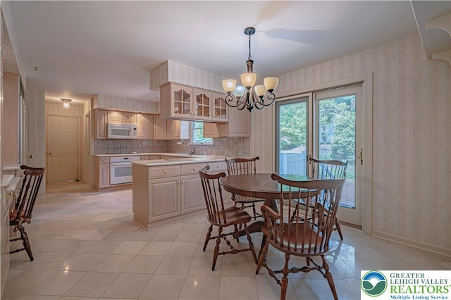 1845 Lehigh Pkwy N, Allentown City, PA 18103 - dining room with wallpapered walls, a chandelier, and light tile patterned floors