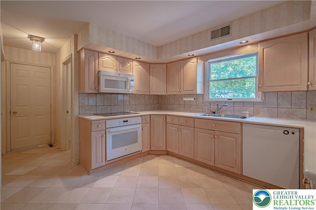 1845 Lehigh Pkwy N, Allentown City, PA 18103 - kitchen featuring white appliances, light brown cabinetry, light countertops, and a sink