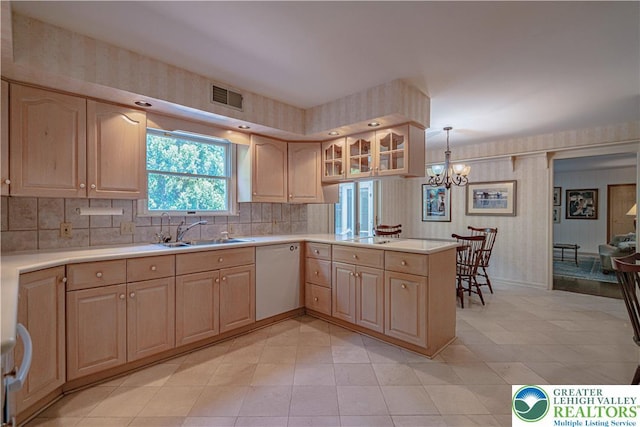 1845 Lehigh Pkwy N, Allentown City, PA 18103 - kitchen with white dishwasher, light brown cabinetry, a sink, a peninsula, and light countertops