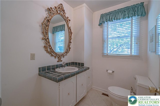 1845 Lehigh Pkwy N, Allentown City, PA 18103 - bathroom with toilet, vanity, tile patterned floors, and baseboards