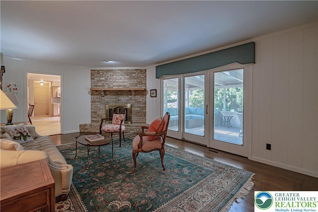 1845 Lehigh Pkwy N, Allentown City, PA 18103 - living area with wood finished floors, crown molding, and a brick fireplace