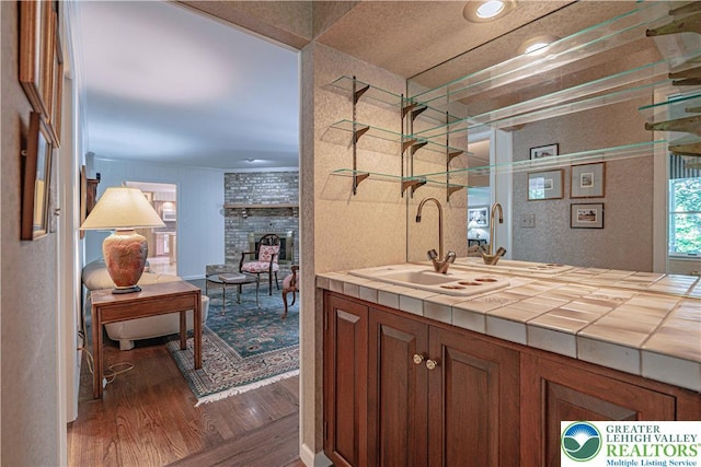 1845 Lehigh Pkwy N, Allentown City, PA 18103 - bar area with a large fireplace, wood finished floors, and a sink