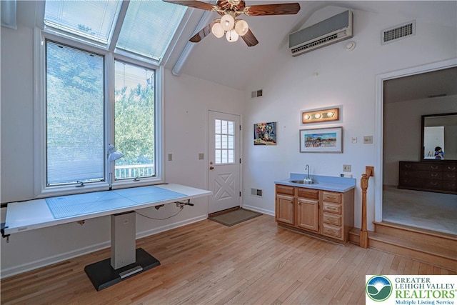 1845 Lehigh Pkwy N, Allentown City, PA 18103 - bathroom featuring wood finished floors, a wall mounted AC, high vaulted ceiling, ceiling fan, and a sink
