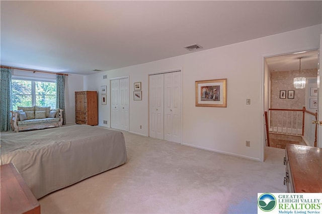 1845 Lehigh Pkwy N, Allentown City, PA 18103 - bedroom with multiple closets, light colored carpet, baseboards, and a chandelier