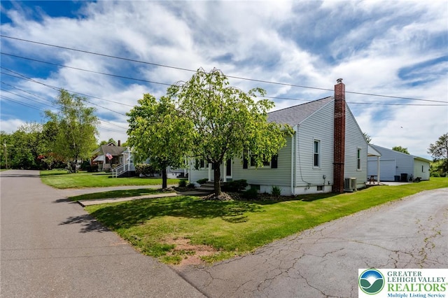 46 Jefferson St, Weatherly Borough, PA 18255 - view of property hidden behind natural elements featuring a chimney, a front lawn, and central air condition unit