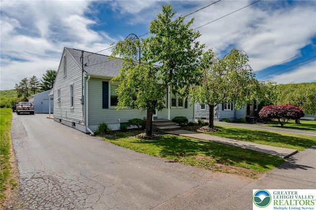 46 Jefferson St, Weatherly Borough, PA 18255 - view of property hidden behind natural elements with a front yard and a shingled roof