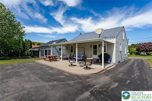 46 Jefferson St, Weatherly Borough, PA 18255 - rear view of property featuring a patio area and roof with shingles