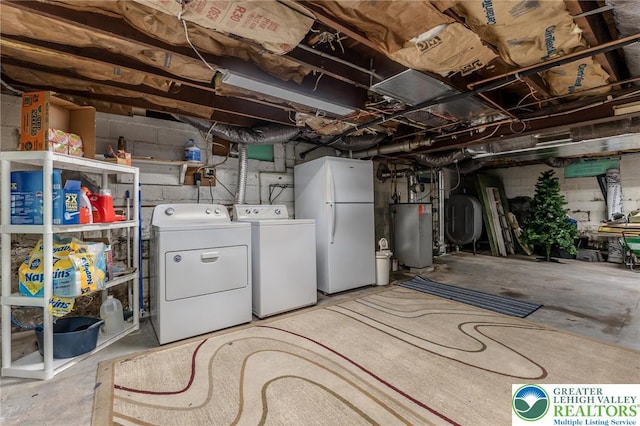 46 Jefferson St, Weatherly Borough, PA 18255 - unfinished below grade area with freestanding refrigerator, washing machine and clothes dryer, water heater, and oil tank