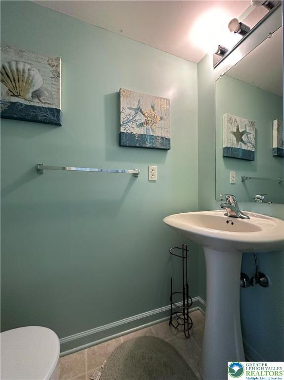 519 Lehigh Gap St, Walnutport Borough, PA 18088 - half bath featuring toilet, baseboards, and tile patterned flooring
