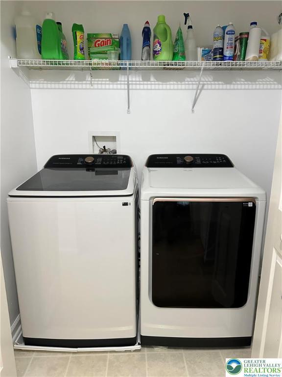 519 Lehigh Gap St, Walnutport Borough, PA 18088 - laundry room featuring independent washer and dryer and light tile patterned floors