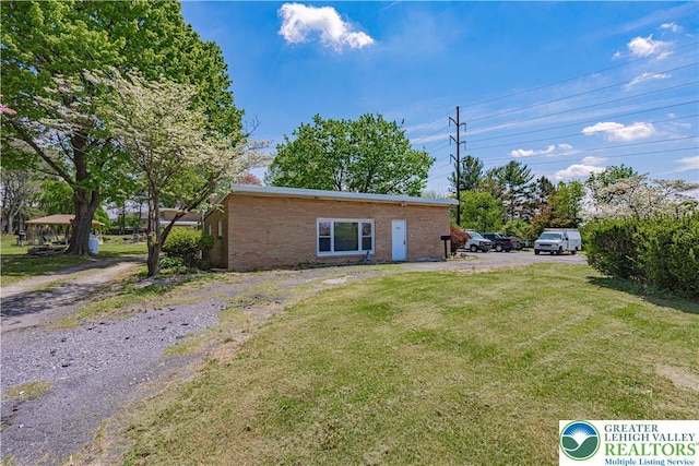4205 Lehigh St, Whitehall Twp, PA 18052 - view of side of property with a lawn and brick siding