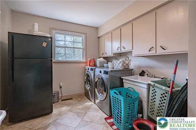4205 Lehigh St, Whitehall Twp, PA 18052 - washroom with cabinet space, washing machine and clothes dryer, and baseboards