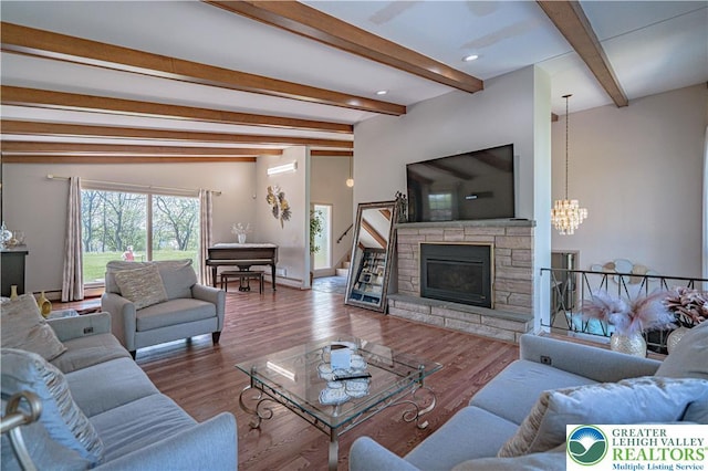 4205 Lehigh St, Whitehall Twp, PA 18052 - living room featuring beamed ceiling, a chandelier, a fireplace, wood finished floors, and baseboards