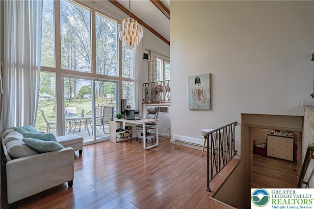 4205 Lehigh St, Whitehall Twp, PA 18052 - office area featuring a towering ceiling, baseboards, a chandelier, and wood finished floors
