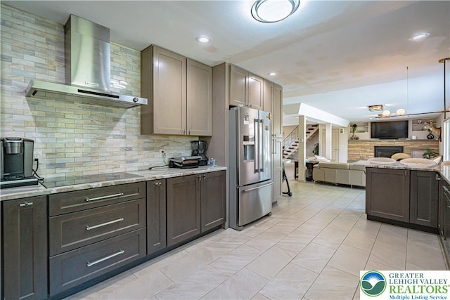 4205 Lehigh St, Whitehall Twp, PA 18052 - kitchen with stainless steel refrigerator with ice dispenser, wall chimney range hood, backsplash, open floor plan, and black electric stovetop
