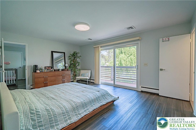 4205 Lehigh St, Whitehall Twp, PA 18052 - bedroom with access to exterior, a baseboard heating unit, and wood finished floors