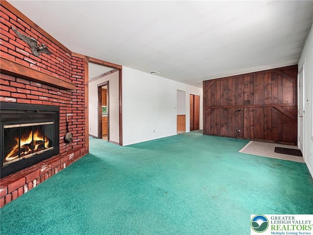 1218 Avocet Dr, Upper Macungie Twp, PA 18031 - unfurnished living room featuring a brick fireplace and carpet flooring
