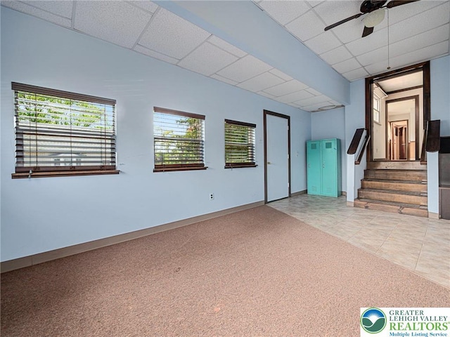 1218 Avocet Dr, Upper Macungie Twp, PA 18031 - unfurnished room featuring light carpet, a drop ceiling, stairway, a ceiling fan, and light tile patterned flooring