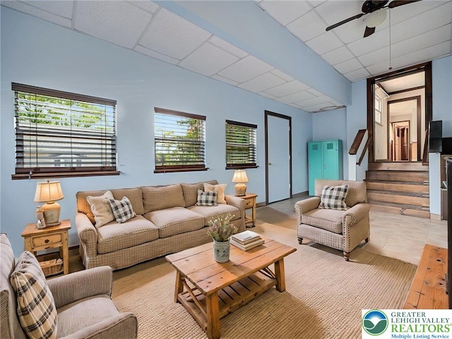 1218 Avocet Dr, Upper Macungie Twp, PA 18031 - living area featuring a drop ceiling, ceiling fan, and stairway