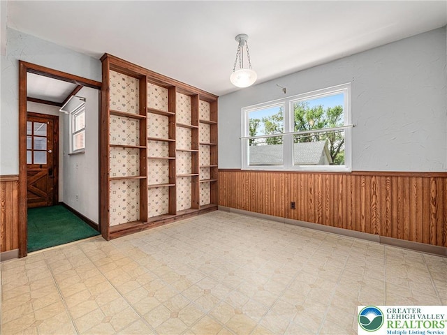 1218 Avocet Dr, Upper Macungie Twp, PA 18031 - unfurnished room featuring light floors, wainscoting, and wood walls