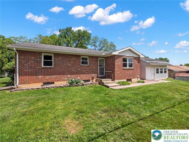 1218 Avocet Dr, Upper Macungie Twp, PA 18031 - ranch-style house with a front yard, brick siding, and a garage