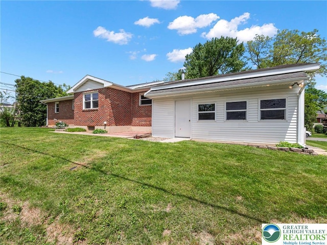1218 Avocet Dr, Upper Macungie Twp, PA 18031 - back of property with a yard and brick siding