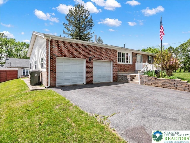 1218 Avocet Dr, Upper Macungie Twp, PA 18031 - ranch-style home featuring driveway, a garage, brick siding, and a front lawn