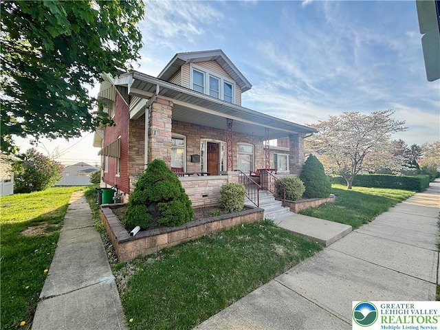 1882 S 2nd St, Allentown City, PA 18103 - bungalow-style house with a front lawn, stone siding, and a porch