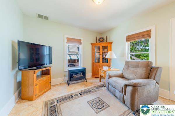 71 N 3rd St, Bangor Borough, PA 18013 - living area featuring a wood stove and baseboards