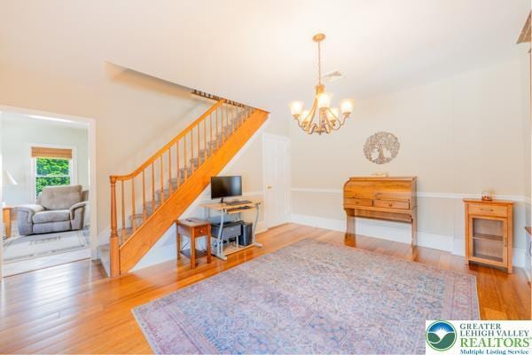 71 N 3rd St, Bangor Borough, PA 18013 - living room with stairs, wood finished floors, and a chandelier