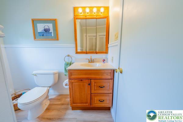 71 N 3rd St, Bangor Borough, PA 18013 - bathroom featuring toilet, wood finished floors, and vanity