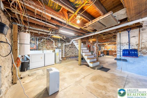 71 N 3rd St, Bangor Borough, PA 18013 - unfinished below grade area with gas water heater, separate washer and dryer, and stairs