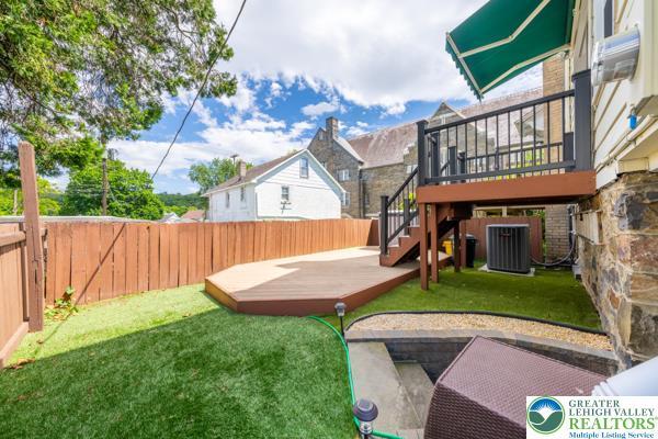 71 N 3rd St, Bangor Borough, PA 18013 - view of yard featuring central AC unit, a deck, and stairs
