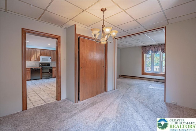 851 N Hoffert St, Fountain Hill Boro, PA 18015 - unfurnished dining area with a baseboard radiator, a paneled ceiling, light carpet, and a chandelier