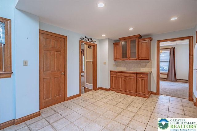 851 N Hoffert St, Fountain Hill Boro, PA 18015 - kitchen featuring brown cabinetry, light countertops, glass insert cabinets, light tile patterned floors, and recessed lighting