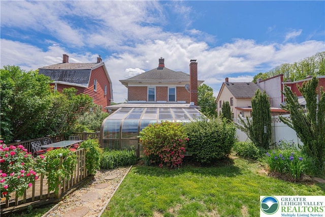 851 N Hoffert St, Fountain Hill Boro, PA 18015 - back of property featuring an exterior structure, an outbuilding, and a chimney