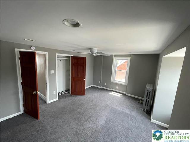 123 N Penn St, Allentown City, PA 18102 - unfurnished bedroom featuring radiator, dark carpet, baseboards, and a ceiling fan