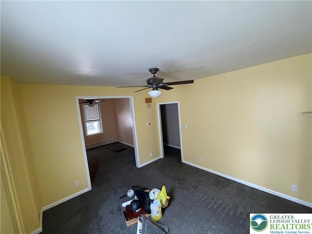 123 N Penn St, Allentown City, PA 18102 - unfurnished bedroom featuring a baseboard radiator, baseboards, dark colored carpet, and a ceiling fan