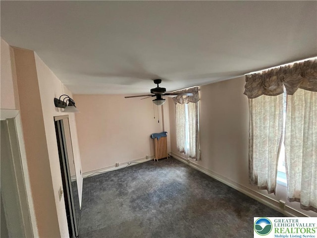 123 N Penn St, Allentown City, PA 18102 - spare room featuring a ceiling fan, dark carpet, and radiator heating unit
