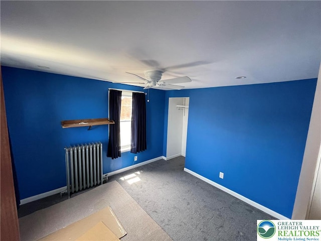 123 N Penn St, Allentown City, PA 18102 - carpeted spare room featuring radiator heating unit, a ceiling fan, and baseboards